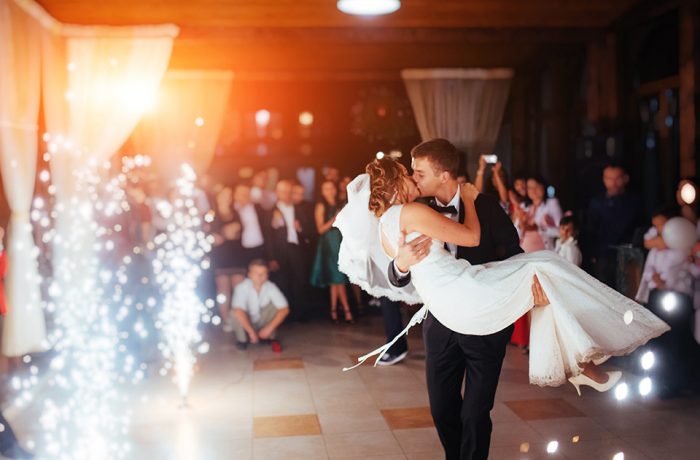 Happy bride and groom a their first dance, wedding in the elegant restaurant with a wonderful light and atmosphere