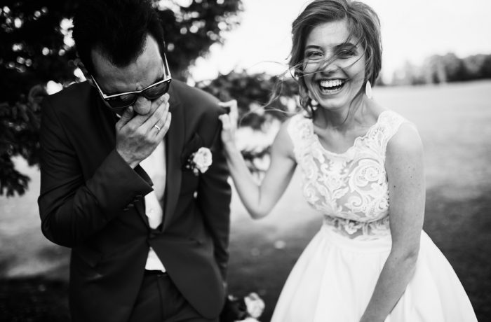 Happy bride and groom spending time in the park